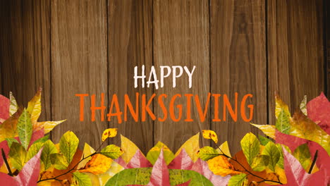 animation of happy thanksgiving overautumn leaves and wooden background