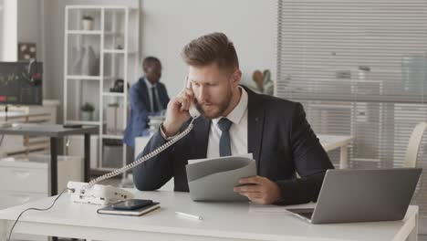 male broker cooperating with investors through phone call