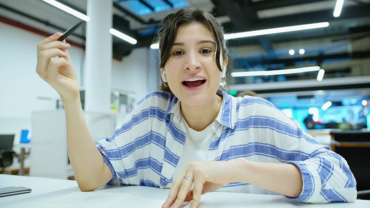Young Smiling Businesswoman Web Conferencing in the Office