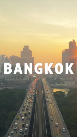 vertical video drone shot of thai city skyline at sunset overlaid with animated graphic spelling out bangkok