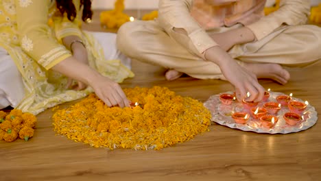 indian couple decorating home for diwali