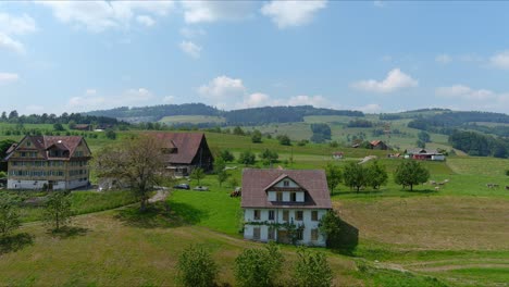 kussnacht flyover: moving over scenic water valley and village in alps mountains, switzerland, europe, drone | dramatic cinematic reveal of vast home on countryside