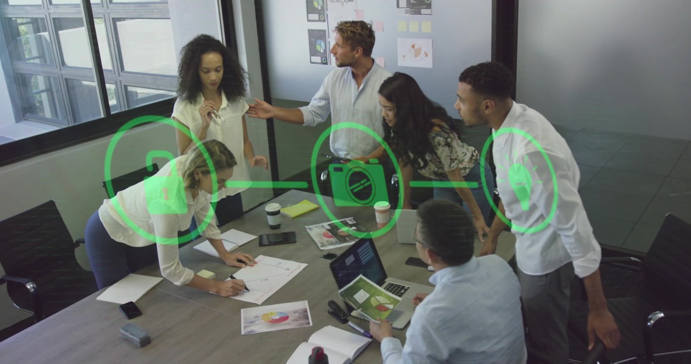 Animation of flowchart of icon over diverse coworkers sharing ideas in office
