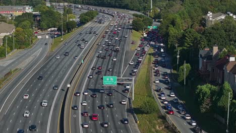 Aerial-view-of-many-cars-on-intersection-and-exit-of-Atlanta-Downtown-during-sunny-day