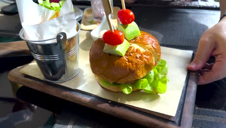 delicious burger with fries and salad