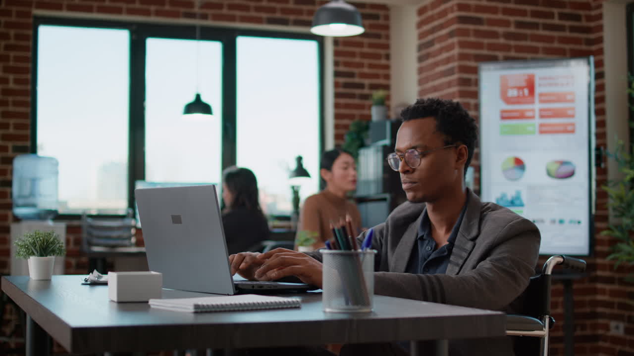 Male employee looking at financial charts on documents