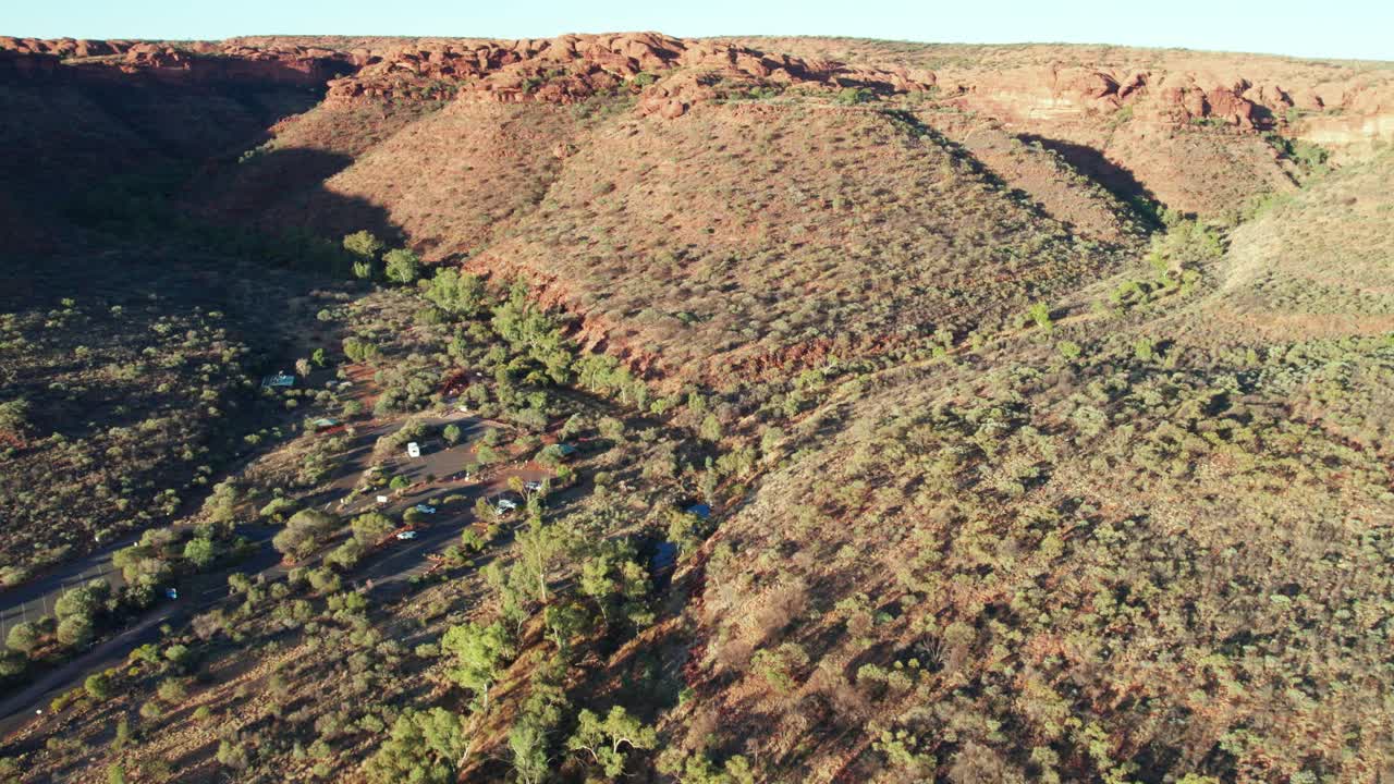 Aerial view heading towards Kings Canyon, Watarrka, in the Northern Territory, Australia. August 2022.