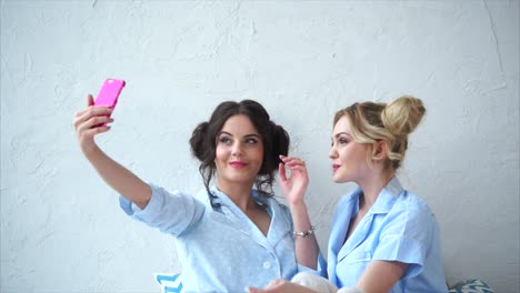 two friends taking a selfie in pajamas
