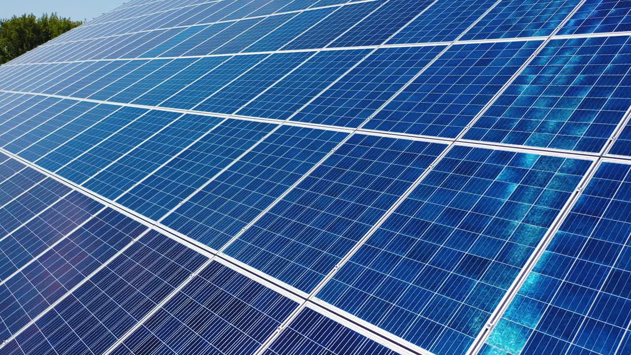 Solar power panel. Green energy. Electricity. Power energy panels. Solar batteries in field on sunny day. Aerial view. selective crop video focus.