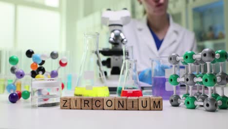 chemical laboratory with zirconium word blocks and scientific equipment