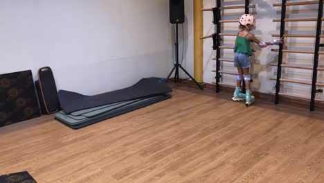 children roller skating in a fitness studio