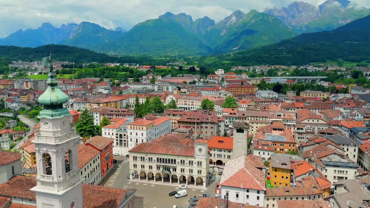 Watch as the drone captures the lush valleys and winding rivers that surround Belluno, showcasing the harmonious blend of nature and urban life.