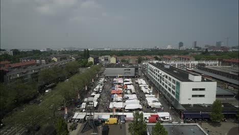 timelapse of busy market in amsterdam from high angle with skyline, plein '40-'45 slotermeer, multicultural area. time lapse