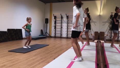 young girls practicing gymnastics