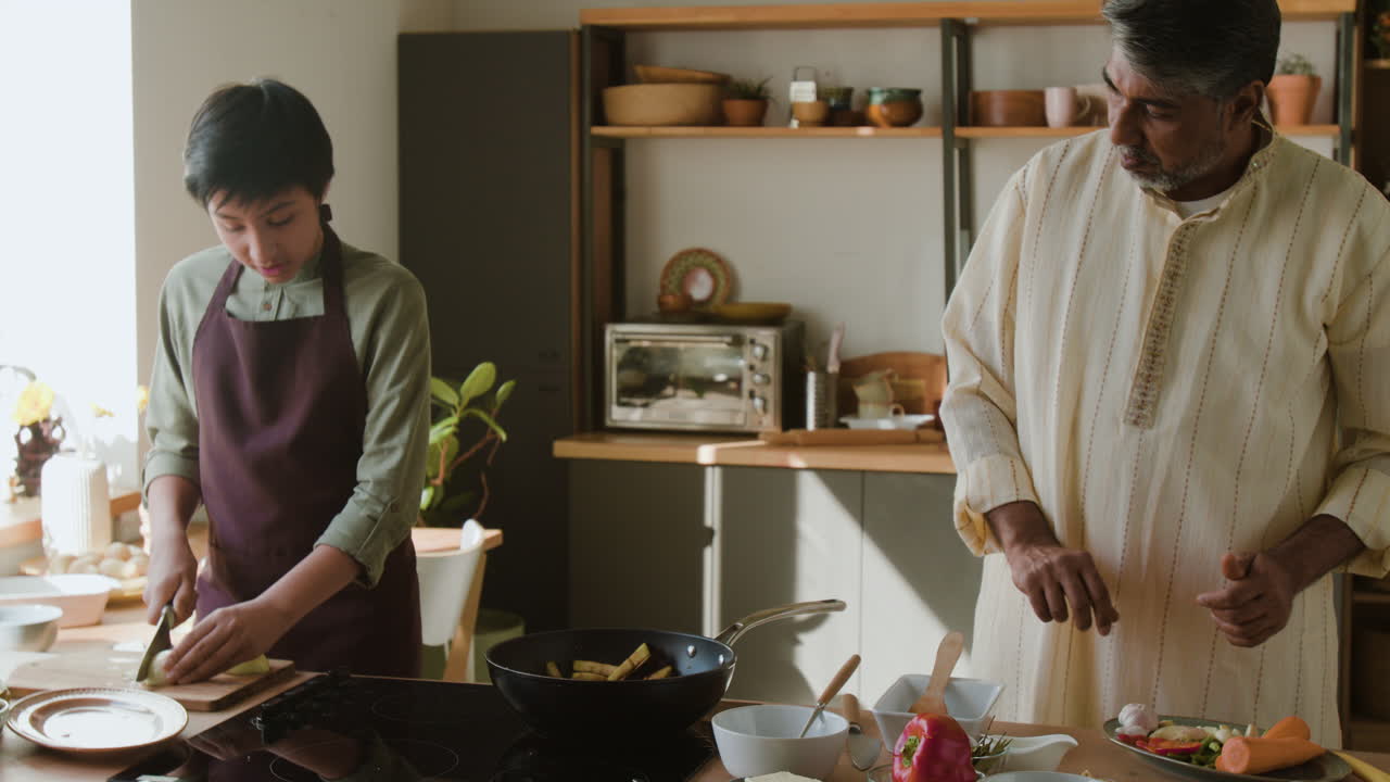 Intergenerational Cooking Lesson in a Home Kitchen