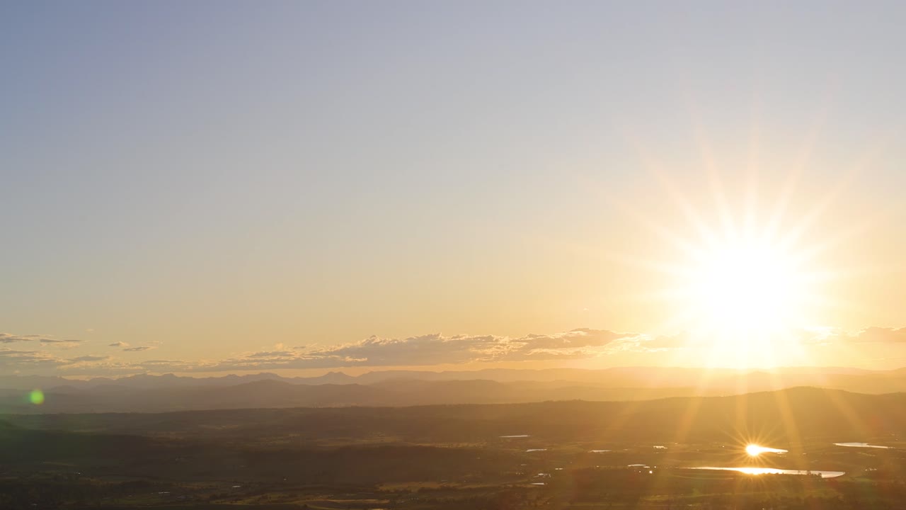 Timelapse of sunset descending over a scenic horizon