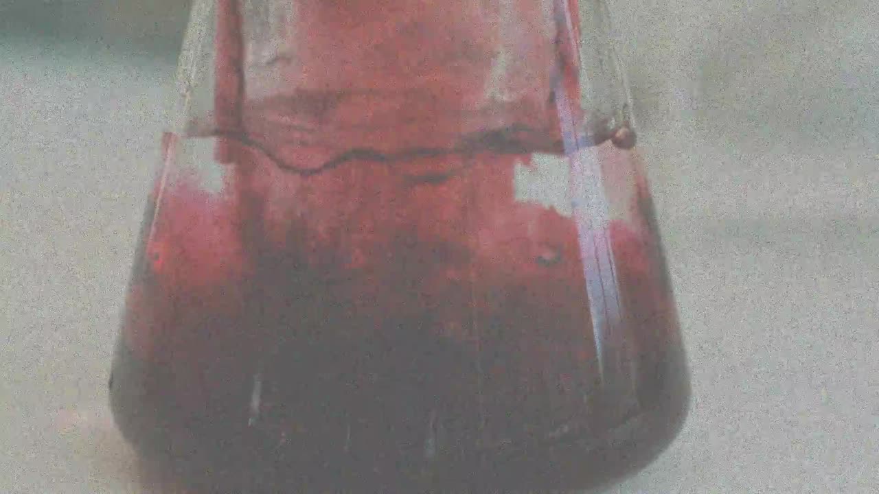 Animation of interference over beaker with liquid in lab