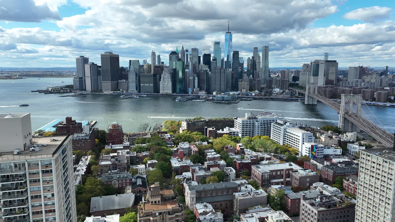 Manhattan Skyline From The Brooklyn Side Of The East River Near Dumbo Neighborhood In New York City, USA. Aerial Drone Shot