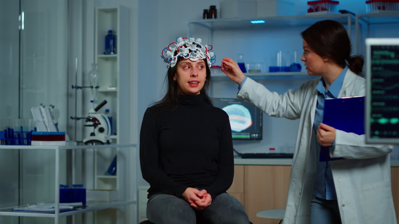 Doctor researcher adjusting EEG headset analyzing patient's evolution