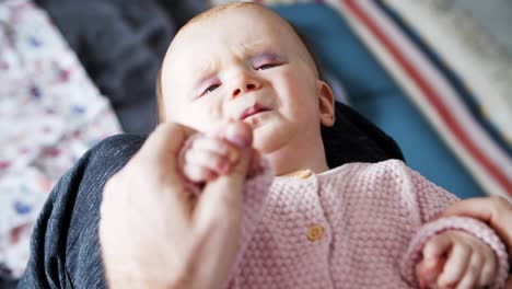 dad soothing annoyed baby daughter