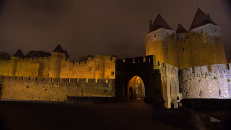 the walls and ramparts of the beautiful carcassone fort in the south of france at night  2