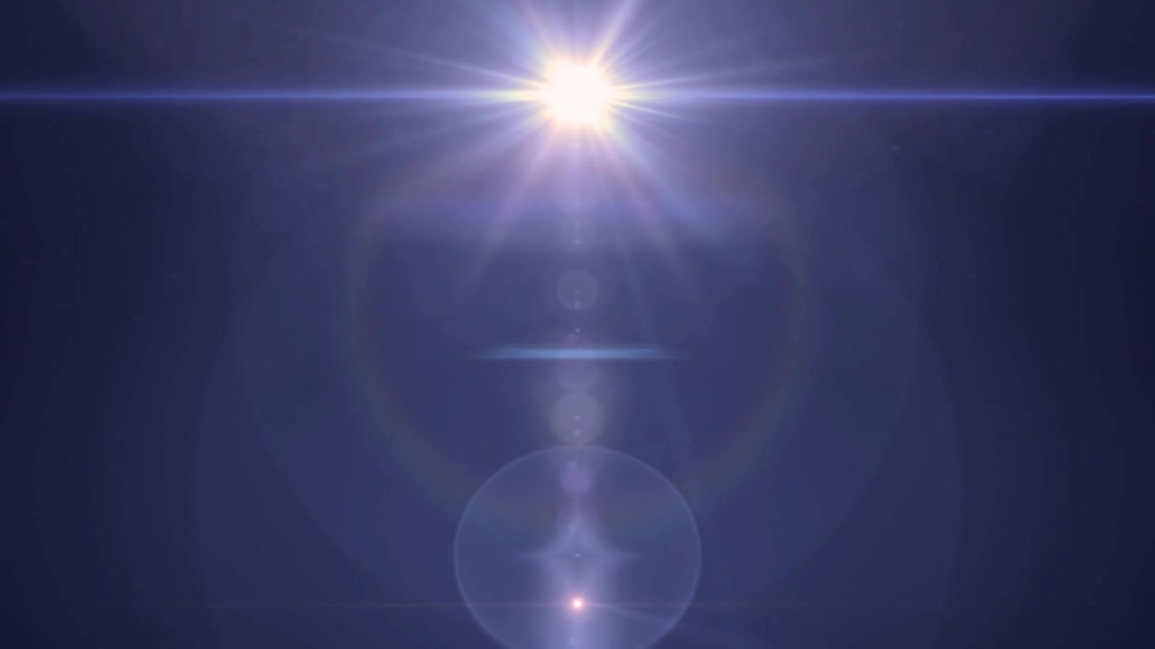 Bagliore di Luce Brillante in Movimento su Sfondo Scuro
