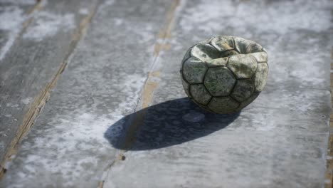 old soccer ball the cement floor