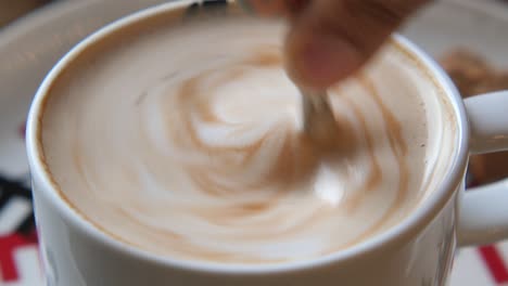latte with a spoon