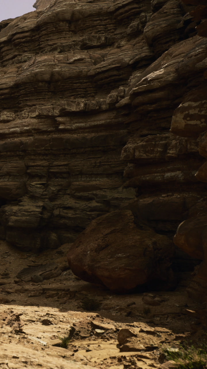 Sunset glow over ancient rock formations in a serene canyon landscape