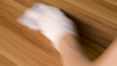 spraying alcohol on the table and cleaning to disinfect viruses and bacteria