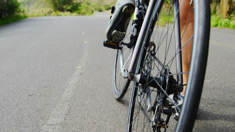 Senior-cyclist-getting-ready-for-cycling-at-countryside-4k