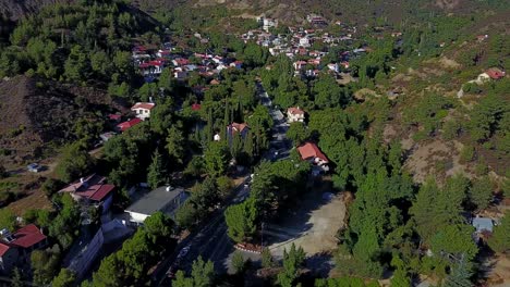 fly-in-reveal-aerial-of-eastern-european-church-and-town-nestled-in-vally