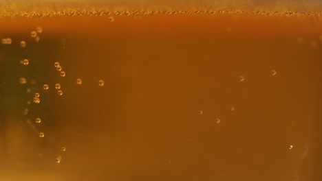 macro golden beer bubbles background