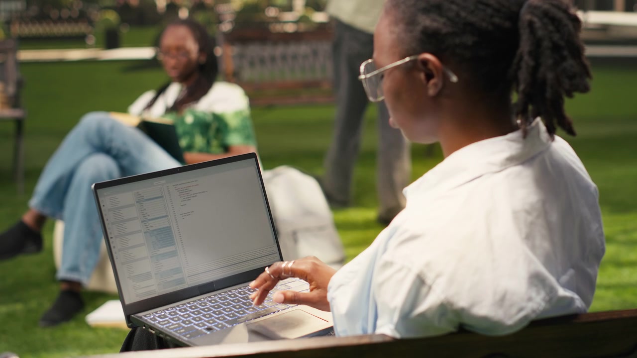 Woman young adult working on binary code programming with laptop screen