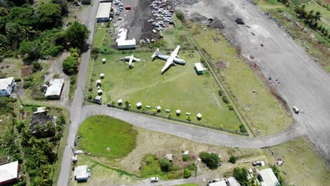 decommissioned planes at pearls airport in grenada, sunny day, aerial view