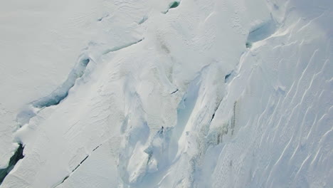 embark on a breathtaking drone journey over a snowy mountain peak