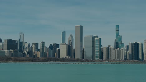 chicago's majestic downtown skyline featuring distinctive skyscrapers and high-rises against a clear blue sky.