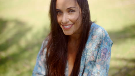 Smiling-Lady-at-Grassy-Ground-Looking-at-Camera