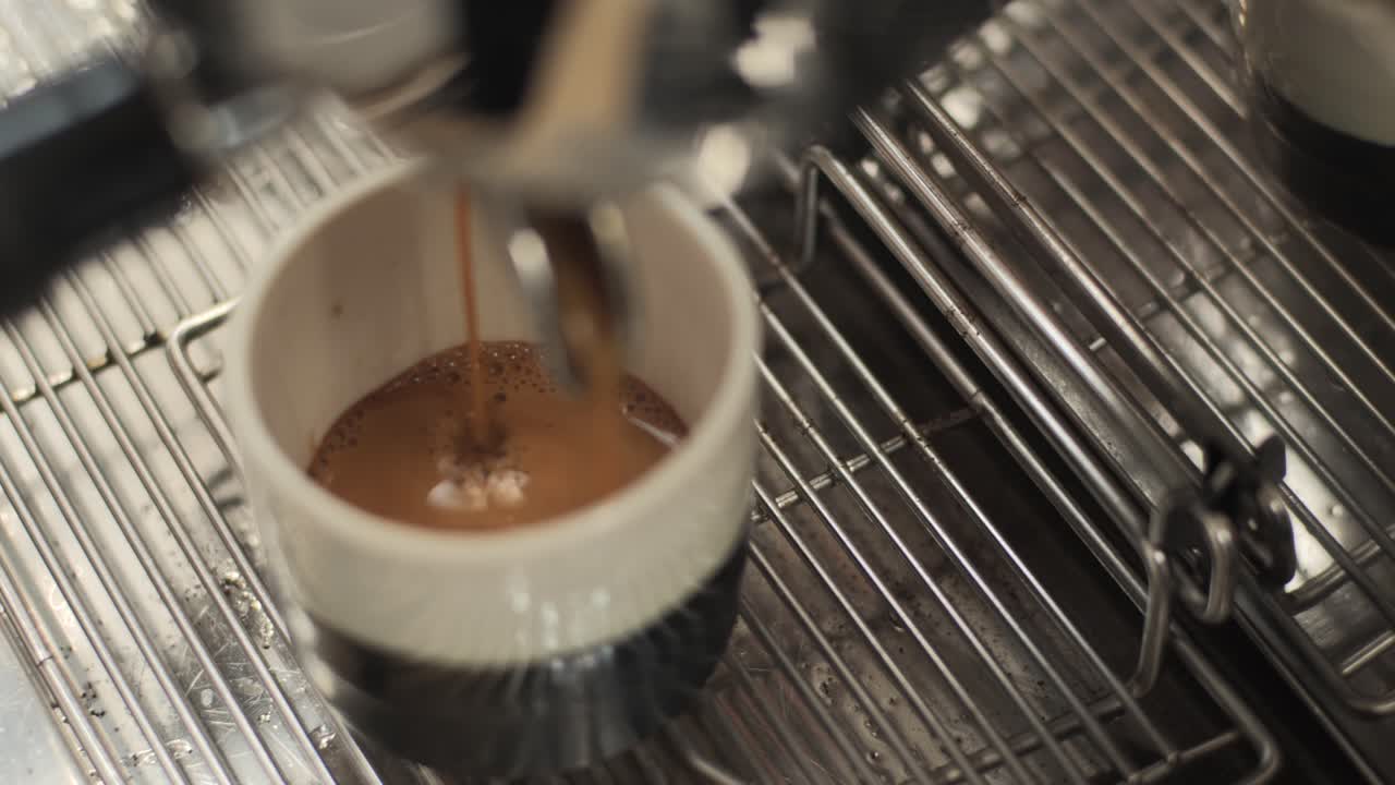Espresso Machine Pouring Espresso into a Cup