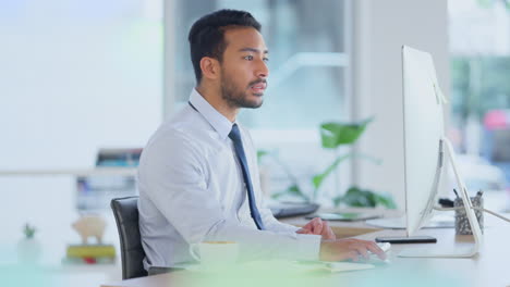 Busy-male-Accountant-typing-an-email-in-a-modern