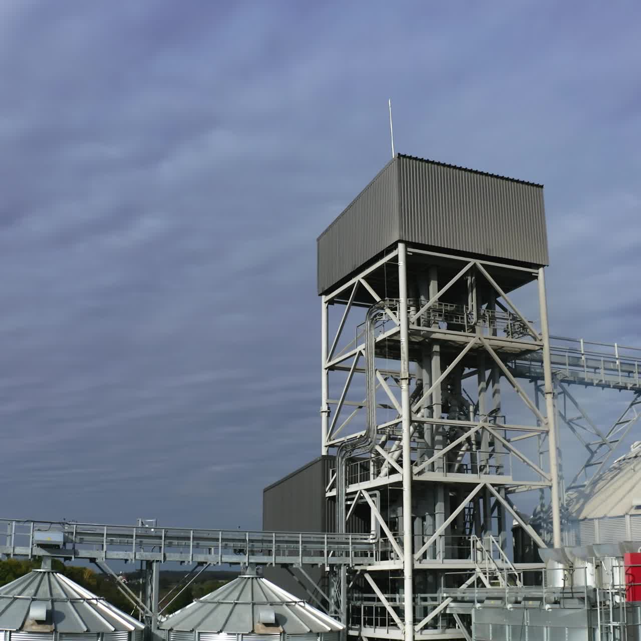 Grain farming harvesting silos. Elevator tanks factory aerial view