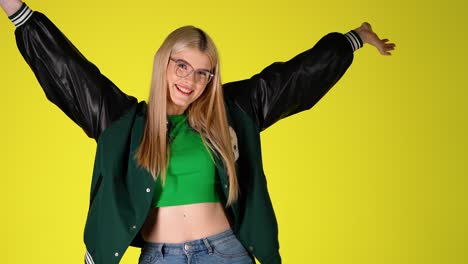 young blonde student happy joyful making cheerful gesture with hands and arms, studio shot