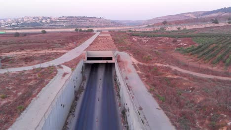 aerial view of highway tunnel and surrounding landscape