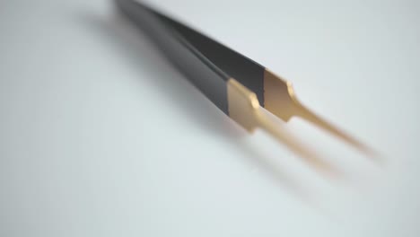 black and gold tweezers used for body grooming and health