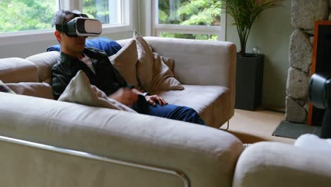 father and son using virtual reality headset in living room 4k