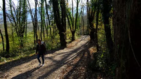 camper man in autumn forest