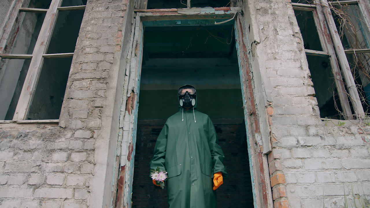 Man in protective suit in destroyed city. Person in apocalypsis city.