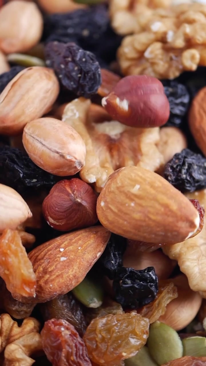 Assorted Nuts and Dried Fruits Falling into a Pile