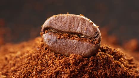 macro shot of coffee bean with brown coffee ground powder sprinkling