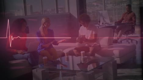 animation of heart rate monitor over group of diverse colleagues discussing together at office